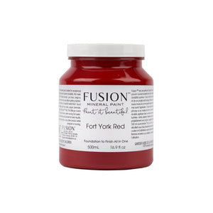 May include: A 500ml jar of Fusion Mineral Paint in Fort York Red.  The label indicates it's a foundation-to-finish paint, suitable for various surfaces. The rich, deep red color is clearly visible.  The jar is shown against a white background.