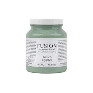 May include: A 500mL bottle of Fusion Mineral Paint in the color French Eggshell. The bottle is a light green color and has a white label with the Fusion logo and the paint color name and size. The label also includes the text 'paint it beautiful'.