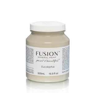 May include: A 500mL jar of Fusion Mineral Paint in the color Eucalyptus. The jar is white with a black label that reads 'Fusion Mineral Paint paint it beautiful™ Eucalyptus 500mL 16.9 fl oz NON CONG'.