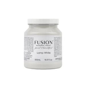 May include: A white plastic jar of Fusion Mineral Paint in the color Lamp White. The jar is labeled with the Fusion logo and the words 'paint it beautiful.' The jar is 500mL or 16.9 fl oz.