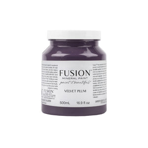 May include: A 500ml jar of Fusion Mineral Paint in Velvet Plum.  The label features the brand name and color name. The paint is a deep purple-gray shade. The jar is shown against a white background. The text on the label also indicates that it is 16.9 fl oz.