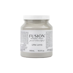 May include: A 16.9 fluid ounce bottle of Fusion Mineral Paint in the color Little Lamb. The paint is a light gray color and is labeled as "paint it beautiful".