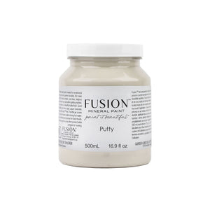May include: A glass jar of Fusion Mineral Paint in the color Putty. The jar is labeled with the brand name and the color name. The jar is 16.9 fluid ounces or 500 milliliters.